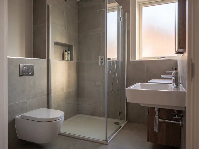 Finished compact bathroom suited to a Reading town-centre apartment or terrace with a wall-hung WC and basin