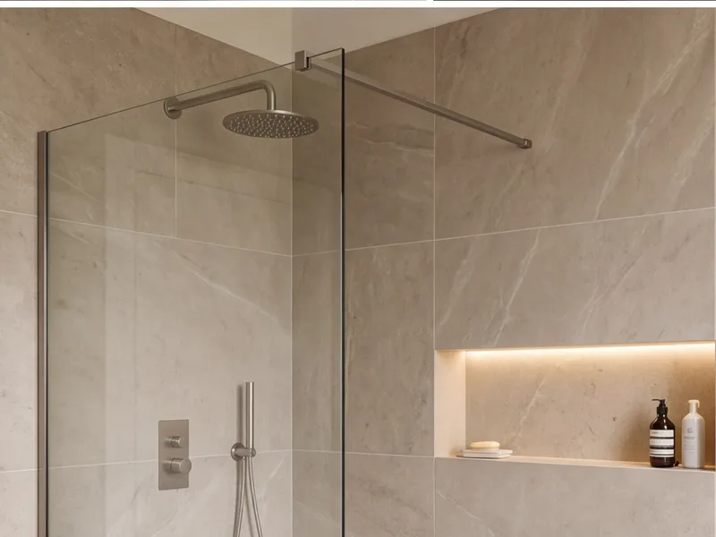 Walk-in shower with large-format porcelain tiling and a frameless glass screen
